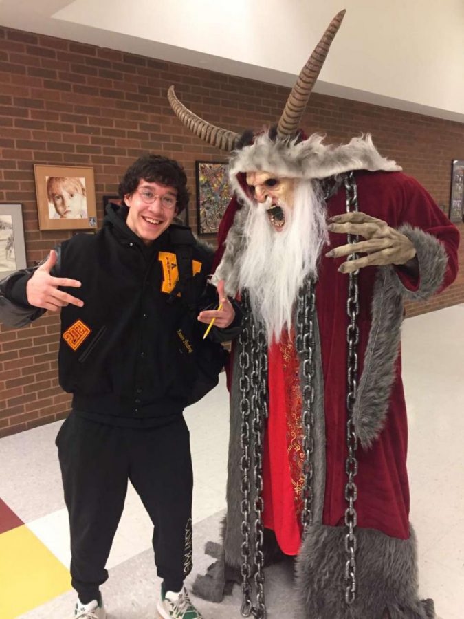Xavier Dockery posing with Dr. Hartnell in his Krampus outfit.