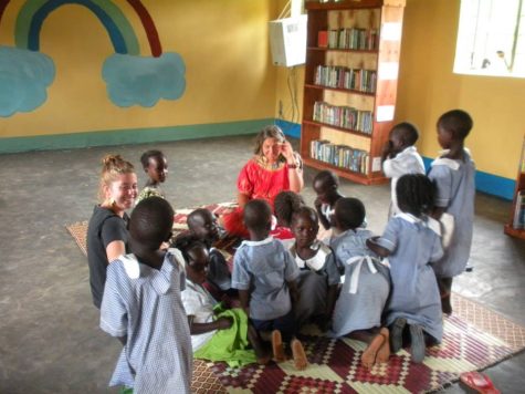 Girls and boys alike attend school in Uganda. They are alongside Diane Ross and other members of FOYA Uganda.