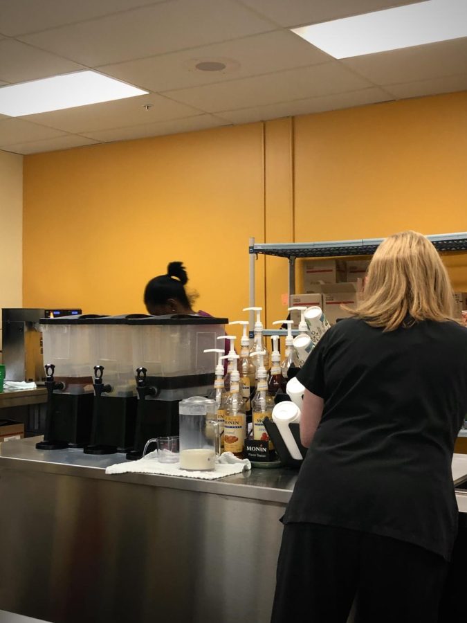 Workers at Westerville North’s new cafe in the gallery prepare an order. Many coffee lovers are excited about this addition to North.