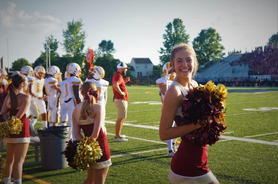 WNHS Cheerleader Abby Scurlock (11) prepares for the first football game of the 2022 season. This season marks Scurlocks 3rd year cheering with Westerville North.