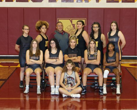 The WNHS Girls Wrestling team takes a team photo. This is the first all-girls team photo taken for wrestling.