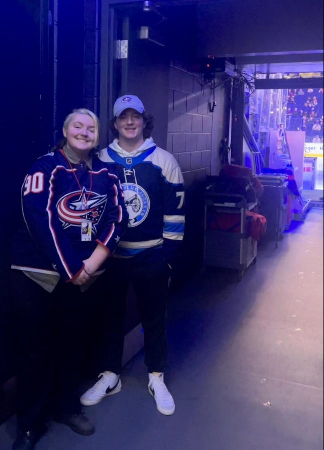 Odyssey staff members Theodore Garrett (11) and Dillon Hittle (12) await the
players to enter the rink inside of the Team Tunnel.