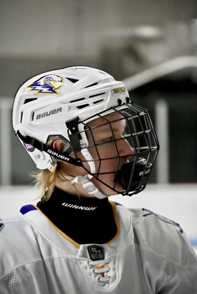 Max Garrett (2026) wears a Winnwell neck guard during his hockey game. Garrett opted into wearing this production, but youth organizations are beginning to mandate them.