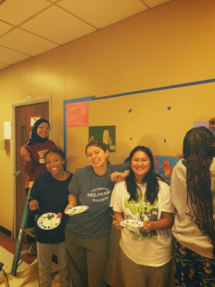 An image showing seniors who attended the senior mural painting day. Seniors in picture from left to right: Safia Raki, Simiya Johnson-Hunter, Sarah Harvey, Mia Richards, and Kennedy Easter. 