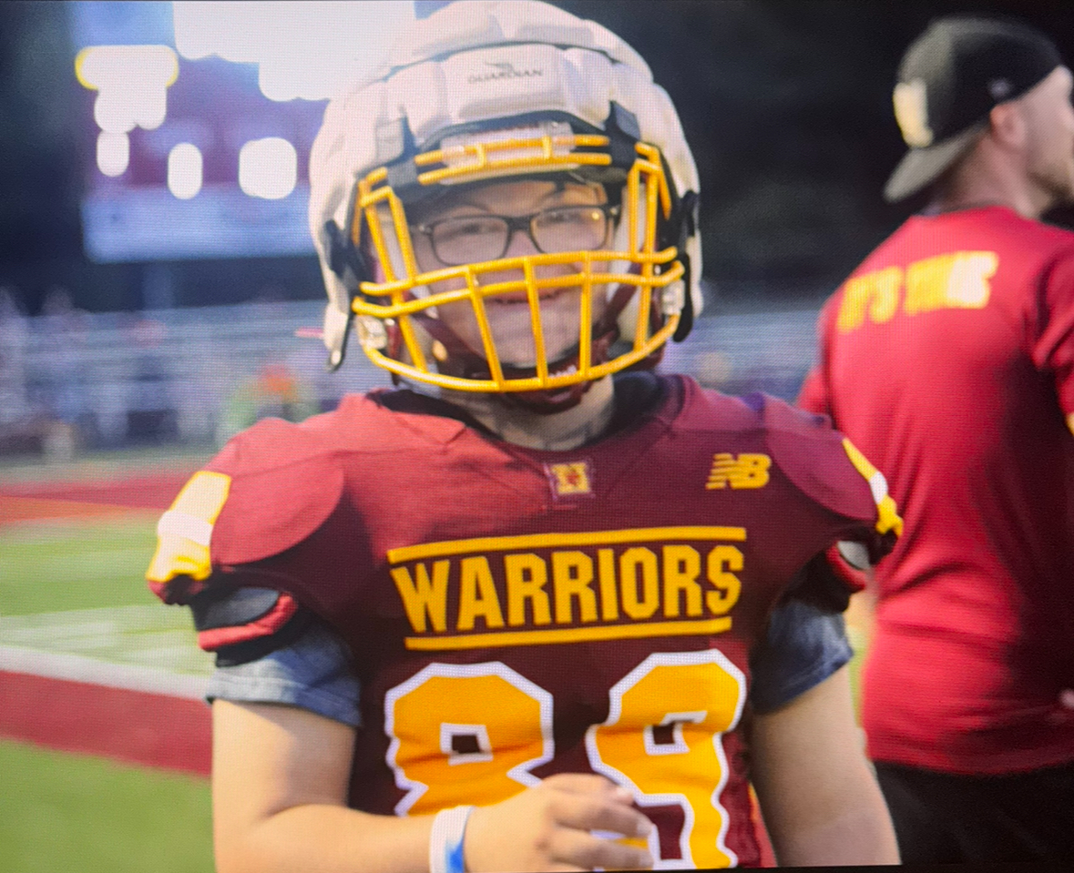 Micah Stein smiling after scoring a touchdown for the WNHS football team.