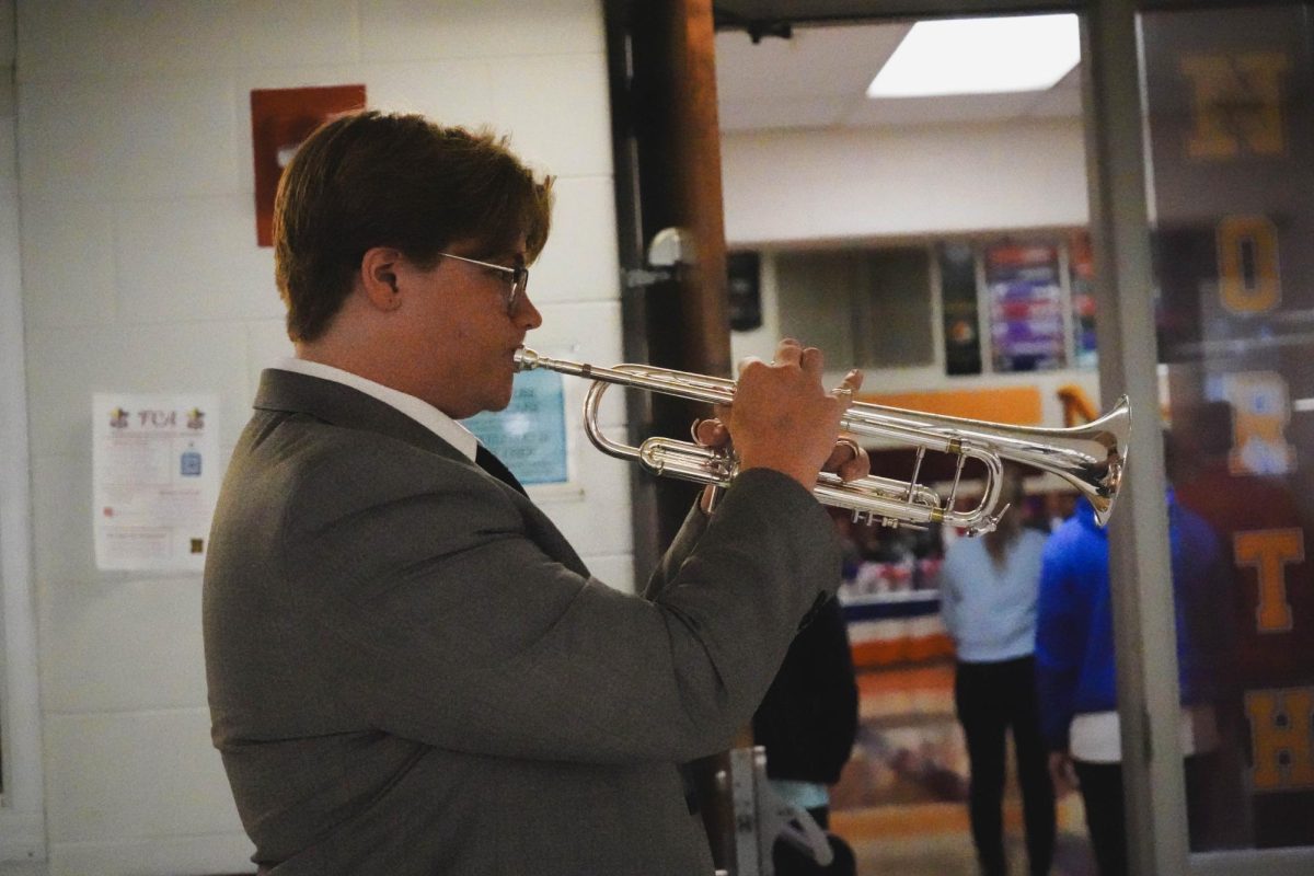 Leo Garcia ('25) plays the traditional military bugle call, Taps.