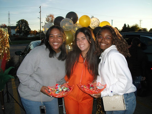 Milani Howard (2026) (left), Teresa Fernandez (2025) (middle), and Mariah Chaffin (2025) (right) display their candy for trunk-or-treat at Westerville North.