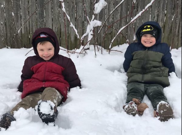 Twin brothers, Luke (left) and Levi (right) playing in the snow.