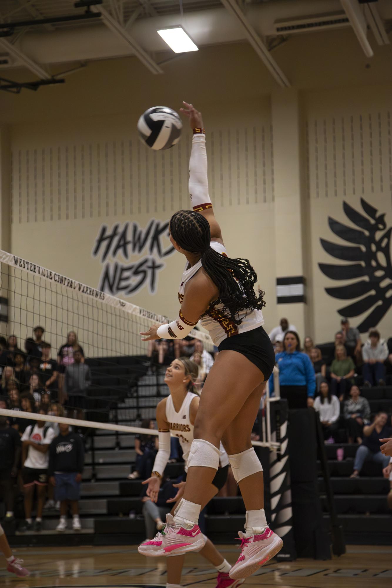 Freshman Kayla Brooks playing outside hitter on varsity. 