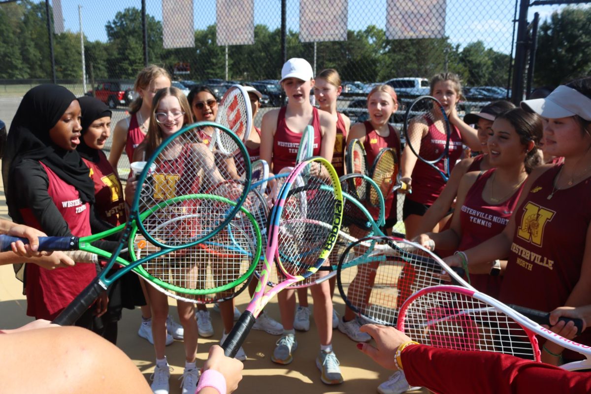The team racqueting in before a match. 